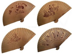Wooden fans punched with various motifs